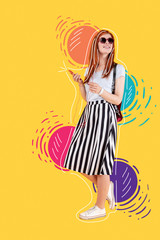 Bright place. Beautiful young girl wearing sunglasses and enjoying the music in her earphones while walking in a lovely park