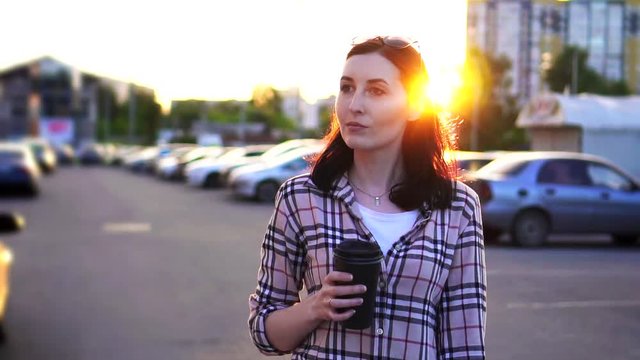 Portrait pretty young woman with coffee in his hand goes to work