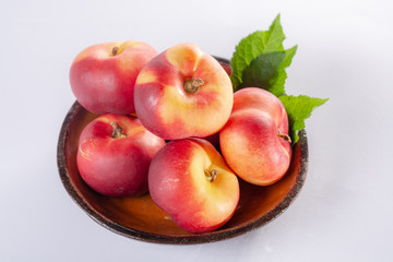 New hybrid sweet fruit nectarina platerina, flat Saturn or donut nectarine peaches close up