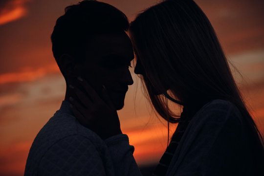 Loving couple.Together.Couple at sunset.Sunset.Love.Feeling.Tenderness.Silhouette photo