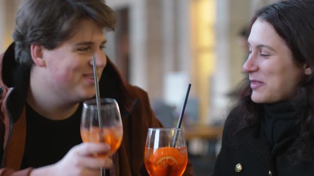 happy Young couple talking,chatting and toating at the bar