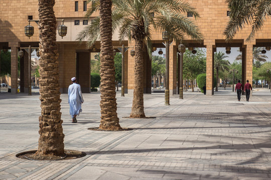 RIYADH, SAUDI ARABIA - OCTOBER 15, 2015. A saudi arabian muslim man walks on Deera Square or Chop-Chop Square in the center of Riyadh near mosque
