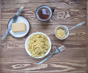 Breakfast from Italian pasta, grated cheese, coffee