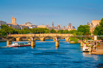 Sunset view on bridge Pont des Arts and buildings on the Seine river in Paris, France