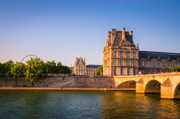 View on Pont Royal and Louvre Museum from Seine river in Paris, France