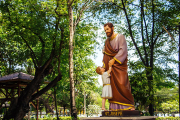 Saint Joseph and the Infant Jesus outside Saint Joseph Catholic Church, Ayutthaya Thailand - Powered by Adobe