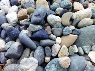 A variety of volcanic cobble stones on the beach in the Pacific Northwest