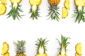 Frame of juicy pineapple fruits on white background. Flat lay, top view. Food concept.