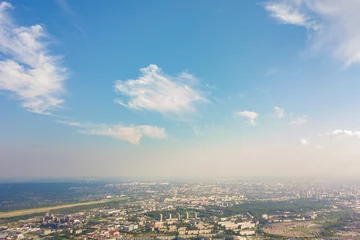 Foto op Canvas Photographing from a quadrocopter to a large  city,  highways, a green forest and a large field on a warm, sunny summer day © Виталий Сова