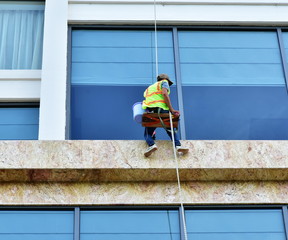 Window washers on the facade of the building. Vietnam. Nha Trang