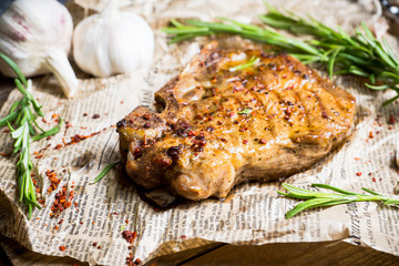 Grilled meat on the rustic background. Selective focus. Shallow depth of field.