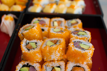 Sushi rolls on a plate with Seaweed and flying fish
