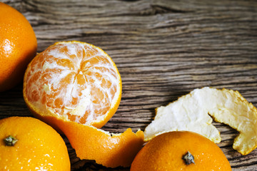 Mandarin oranges on wood background with copy space