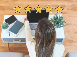 Five Star Rating with woman using her laptop computer