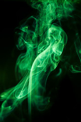 Green smoke movement on black background.