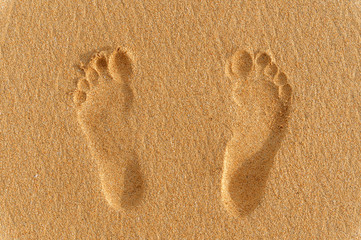 human foot prints on the sand 
