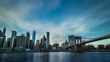 Fototapeta na wymiar Manhattan skyline with Brooklyn Bridge shot at sunset