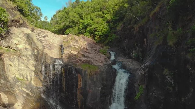 Video over the waterfall in the gorge. Tropical waterfall in Thailand