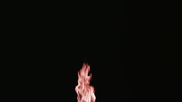 Slow motion vertical flames that grow larger for use with visual effects and/or design and texturing.