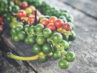 Green and red peppercorns