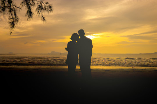 Silhouette of loving couple .