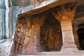Cave 3 : View of verandah, from outside. Badami Caves, Karnataka. Figures seen from left to right - Harihara, partial view of Vishnu seated on the hooled serpant Shesha, and Varaha.