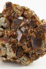 Uncut and rough deep red rhodolite garnet gemstone.