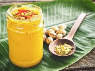 Mango lassi on banana leaves Indian drink