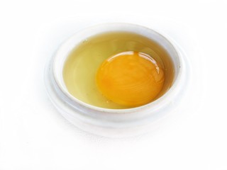 Eggs in a bowl isolated white background