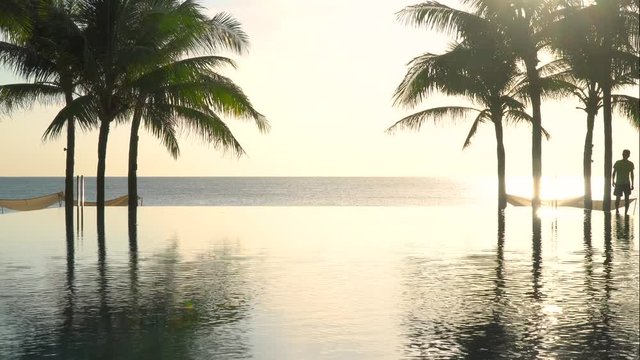 Pool by the beach in the morning with floating unicorn