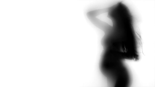Pregnant woman shadow portrait isolated on white background. Silhouette of pregnant woman touching her belly. Pregnancy concept. Baby Shower. Slow motion 4K UHD video 3840x2160