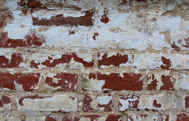 texture old peeling brickwork of red brick