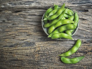 Green peas bean on wood background