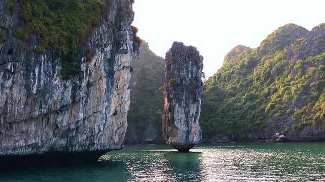 Limestone rock pillar in the water in Ha Long Bay, Vietnam