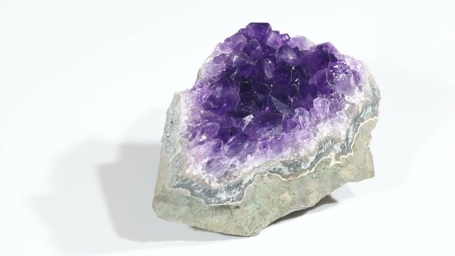 video with rotate small violet amethyst crystals