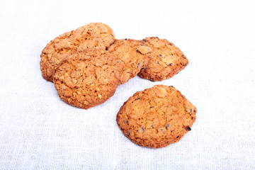 Fresh homemade bread, cake and muffin on Sackcloth woven texture background. Selective focus.