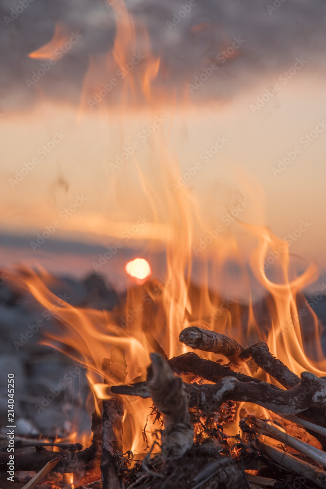 Wall mural fire burns near the sea