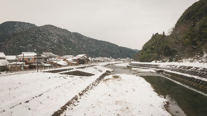 The tsuwano bridge that people used to travel was covered by snow after a blizzard.