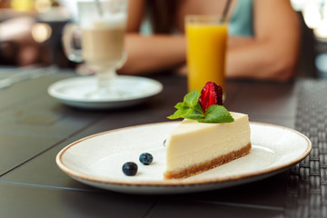 Closeup of cheesecake with strawberry in the cafe.