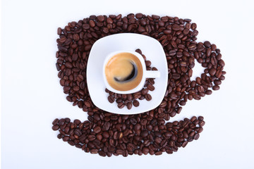 Coffee cup with classic espresso and coffee beans on white background.
