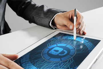 Internet security concept with woman working on media screen with stylus