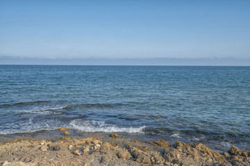 Coast of mediterranean sea with the sky and waves.