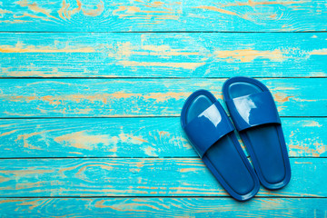 flip-flops on color wooden background
