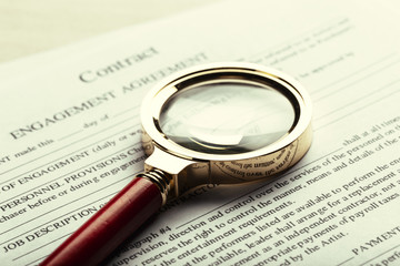 Close up shot of Eyeglasses  on contract document papers business concept