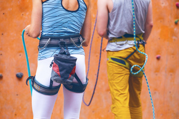 girl climbing up the wall