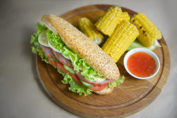Sandwich, corn grill and sauce