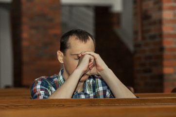 Man praying in church