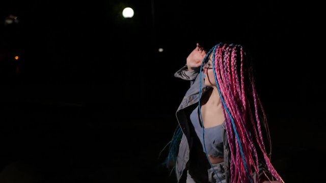 Gorgeous girl is dancing outside