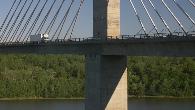 Tractor Trailer Crossing Cable-Stayed Bridge Over River