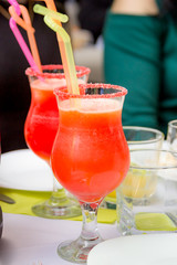 Cosmopolitan cocktail garnished with a lime and berries